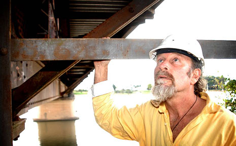 Builder George Oxenbridge checks out the rust and spalling on Grafton Bridge. Builder George Oxenbridge checks out the rust and spalling on Grafton Bridge.