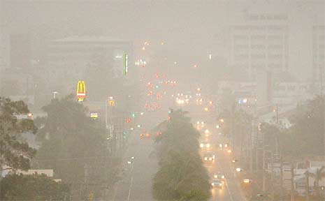 Clouds of dust covered Rockhampton as the sun set at 6pm yesterday. Some buildings on Fitzroy Street weren't visible through the storm. Clouds of dust covered Rockhampton as the sun set at 6pm yesterday. Some buildings on Fitzroy Street weren't visible through the storm.