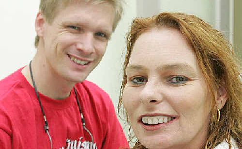 Dentist Lincoln Harris shares a smile with patient Caroline Michell. Dentist Lincoln Harris shares a smile with patient Caroline Michell.