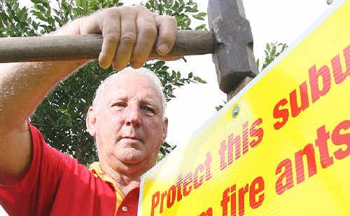 Evan Cordingley installs another fire ant sign in the Ipswich area. Evan Cordingley installs another fire ant sign in the Ipswich area.