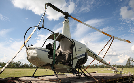 CRASHED CHOPPER: The wreckage of the helicopter was loaded on a trailer and taken to Springsure. CRASHED CHOPPER: The wreckage of the helicopter was loaded on a trailer and taken to Springsure.