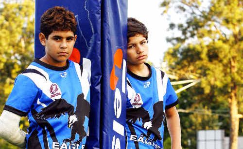 Young Goodna Eagles players Treymain Spry-Gagai (left), Treavon Drahm (right) and Nittest Kumar (seated) think their hero Israel Folau should stay with rugby league. Young Goodna Eagles players Treymain Spry-Gagai (left), Treavon Drahm (right) and Nittest Kumar (seated) think their hero Israel Folau should stay with rugby league.
