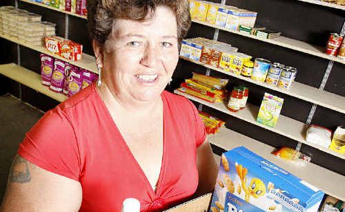 Generation Rescue Revival Centre food bank co-ordinator Kristina Ibbotson with a centre hamper. Generation Rescue Revival Centre food bank co-ordinator Kristina Ibbotson with a centre hamper.