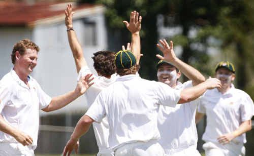 Northsiders bowler Robert Hillier (left) celebrates a wicket with his team mates. Northsiders bowler Robert Hillier (left) celebrates a wicket with his team mates.