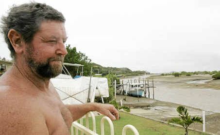 Grant Shultz of Keppel Sands has tied down his boats and is cleaning up in preparation for a cyclone. Grant Shultz of Keppel Sands has tied down his boats and is cleaning up in preparation for a cyclone.