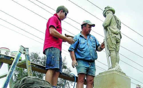 Allora RSL Sub Branch secretary Ken Ashton in front of the statue as Sam Holmes (left) and Robert Wagner fit the new rifle piece. Allora RSL Sub Branch secretary Ken Ashton in front of the statue as Sam Holmes (left) and Robert Wagner fit the new rifle piece.