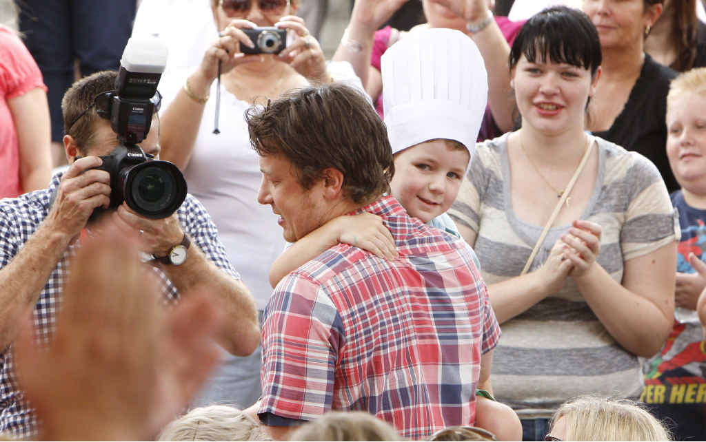 Celebrity chef Jamie Oliver picks Aston Wright from the crowd for his cooking demonstration on Saturday. Celebrity chef Jamie Oliver picks Aston Wright from the crowd for his cooking demonstration on Saturday.