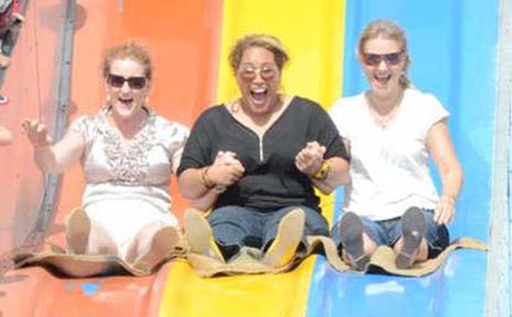SLIP AND SLIDE: Jacqui Pressey, Sela Tuavao and Tammy Malings enjoy the days celebrations. SLIP AND SLIDE: Jacqui Pressey, Sela Tuavao and Tammy Malings enjoy the days celebrations.