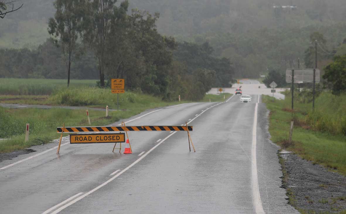 SIGN OF DANGER: The bridge at the Gregory-Cannon Valley turn-off was over flowing on Tuesday blocking residents who lived at Sugarloaf and Strathdickie. Photo Aimee Vinci / Whitsunday Times SIGN OF DANGER: The bridge at the Gregory-Cannon Valley turn-off was over flowing on Tuesday blocking residents who lived at Sugarloaf and Strathdickie. Photo Aimee Vinci / Whitsunday Times