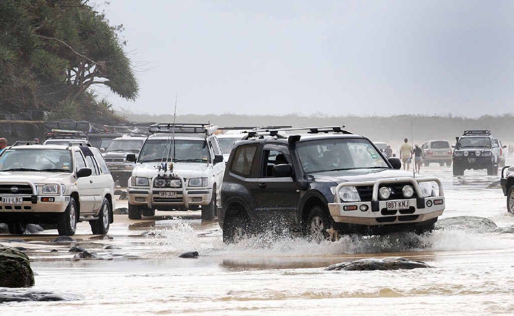 BUSY: Four-wheel drives take on the Mudlo Rocks this Easter at Rainbow Beach. BUSY: Four-wheel drives take on the Mudlo Rocks this Easter at Rainbow Beach.