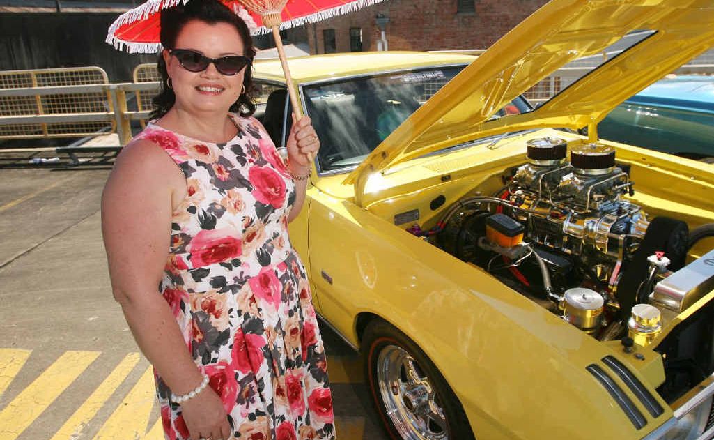 Rachel Azzopardi checks out a 1970 VG Coupe at the Chrysler Show and Shine. Rachel Azzopardi checks out a 1970 VG Coupe at the Chrysler Show and Shine.