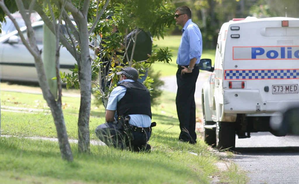 Police officers surround a Halligan St house during an eight-hour siege on Good Friday. Police officers surround a Halligan St house during an eight-hour siege on Good Friday.