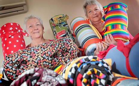 HELPING HANDS: Dianne Hanney and Pam Marshall have been making bags filled with quilts and toys for kids who will be going to camp quality. HELPING HANDS: Dianne Hanney and Pam Marshall have been making bags filled with quilts and toys for kids who will be going to camp quality.