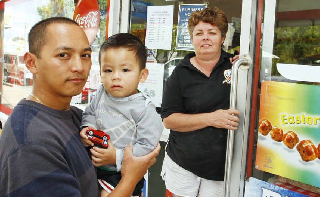 Bakery owner Sherwin Regoso, with son Ryan, 2, and manager Suzie Mellor want more police in town. Photo: David Nielsen Bakery owner Sherwin Regoso, with son Ryan, 2, and manager Suzie Mellor want more police in town. Photo: David Nielsen