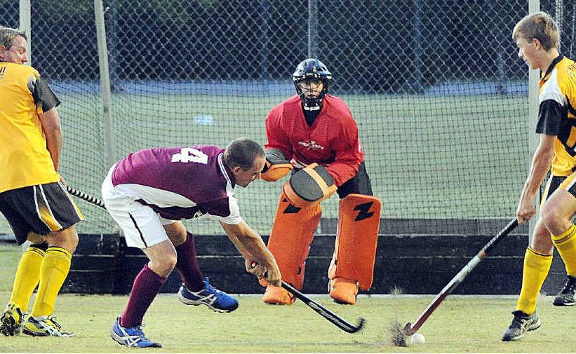 Hervey Bay’s James Manson has the Granville defence hopping as he takes a shot on goal in the Premier League hockey match. Hervey Bay’s James Manson has the Granville defence hopping as he takes a shot on goal in the Premier League hockey match.