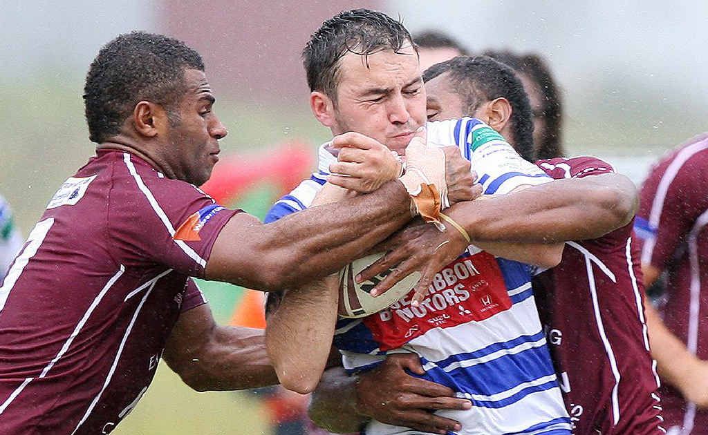 Fassifern tacklers smother a Brothers player during yesterday’s IRL grand final replay at Harrisville. Fassifern tacklers smother a Brothers player during yesterday’s IRL grand final replay at Harrisville.