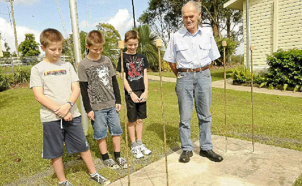 School captains Declan (left) and Sean Allen and Fletcher Creed with project manager Fred Hoskings at the new foundation for the Anzac memorial at Wyrallah public school. School captains Declan (left) and Sean Allen and Fletcher Creed with project manager Fred Hoskings at the new foundation for the Anzac memorial at Wyrallah public school.