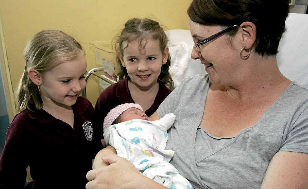 Tanika and Shari Tribe meet their new baby sister, Kaycee Michelle, yesterday after mum Megan Tribe gave birth in the car on the way to hospital. Tanika and Shari Tribe meet their new baby sister, Kaycee Michelle, yesterday after mum Megan Tribe gave birth in the car on the way to hospital.