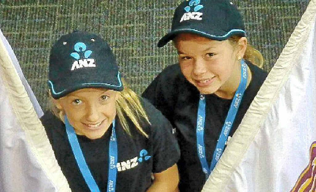 Eleanor Edwardsson and Geogia Laird were flag bearers for the Queensland Firebirds. Eleanor Edwardsson and Geogia Laird were flag bearers for the Queensland Firebirds.