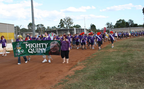 Relay teams line the track behind the Mighty Quinn team as the 18 hour long Relay for Life gets underway. Relay teams line the track behind the Mighty Quinn team as the 18 hour long Relay for Life gets underway.