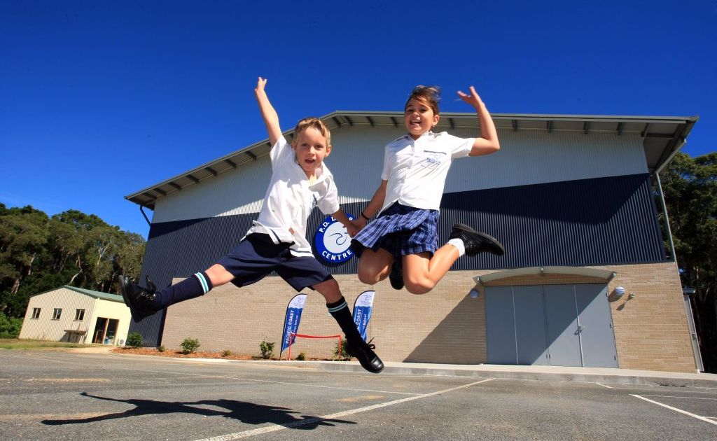 Isaac Gorton, 5, and Elke Borgas, 10, jump for joy at the opening of the new hall at Pacific Coast Christian school. Isaac Gorton, 5, and Elke Borgas, 10, jump for joy at the opening of the new hall at Pacific Coast Christian school.