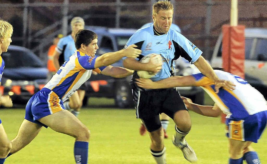 Isis Devils’ Tony McMeekin tries to break through the Waves defence. Isis Devils’ Tony McMeekin tries to break through the Waves defence.