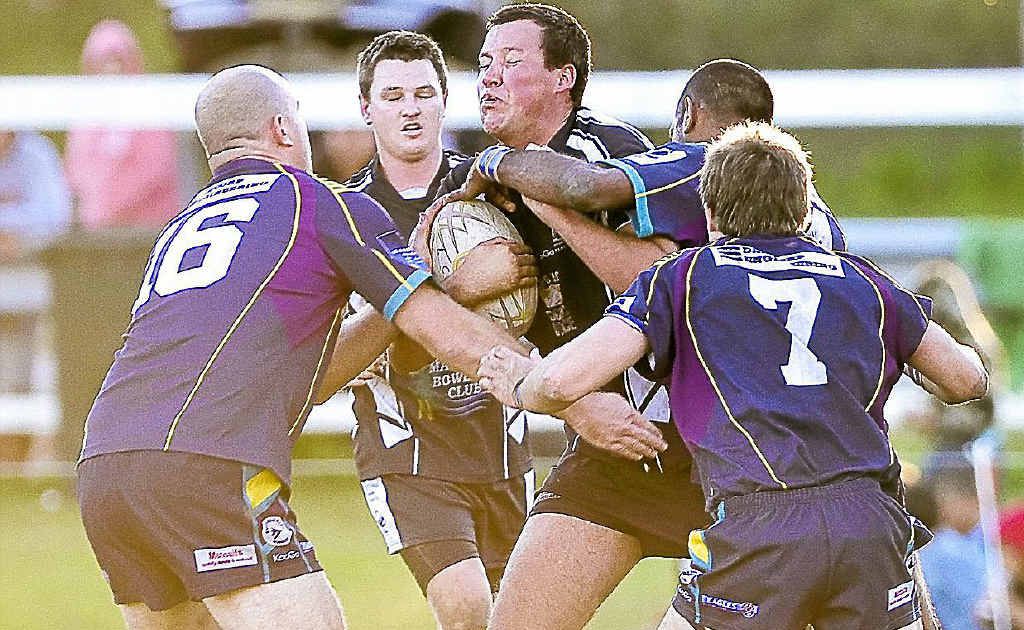 Lower Clarence Magpies’ Jackson Lucas is collared by four Evans Heads defenders as he brings the ball away from his goal-line during their clash last season. Lower Clarence Magpies’ Jackson Lucas is collared by four Evans Heads defenders as he brings the ball away from his goal-line during their clash last season.