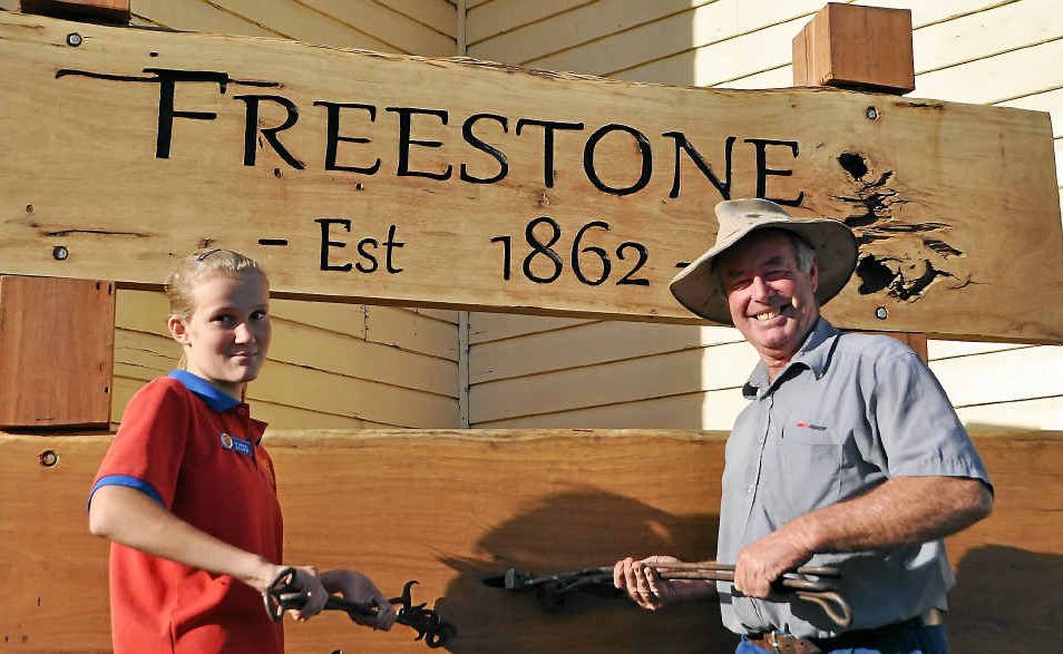 As part of the Freestone 150th celebrations Hannah Briggs and Alan Payne will burn their brands into the branding post that has been erected in honour of the occasion. As part of the Freestone 150th celebrations Hannah Briggs and Alan Payne will burn their brands into the branding post that has been erected in honour of the occasion.