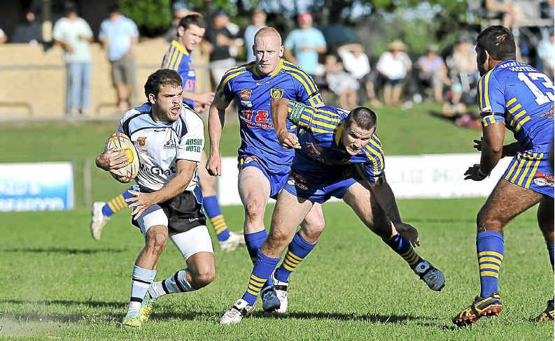 Ballina player Simon Perkins palms off a Marist Brothers opponent during the NRRRL game at Kingsford Smith Park, Ballina. Ballina player Simon Perkins palms off a Marist Brothers opponent during the NRRRL game at Kingsford Smith Park, Ballina.