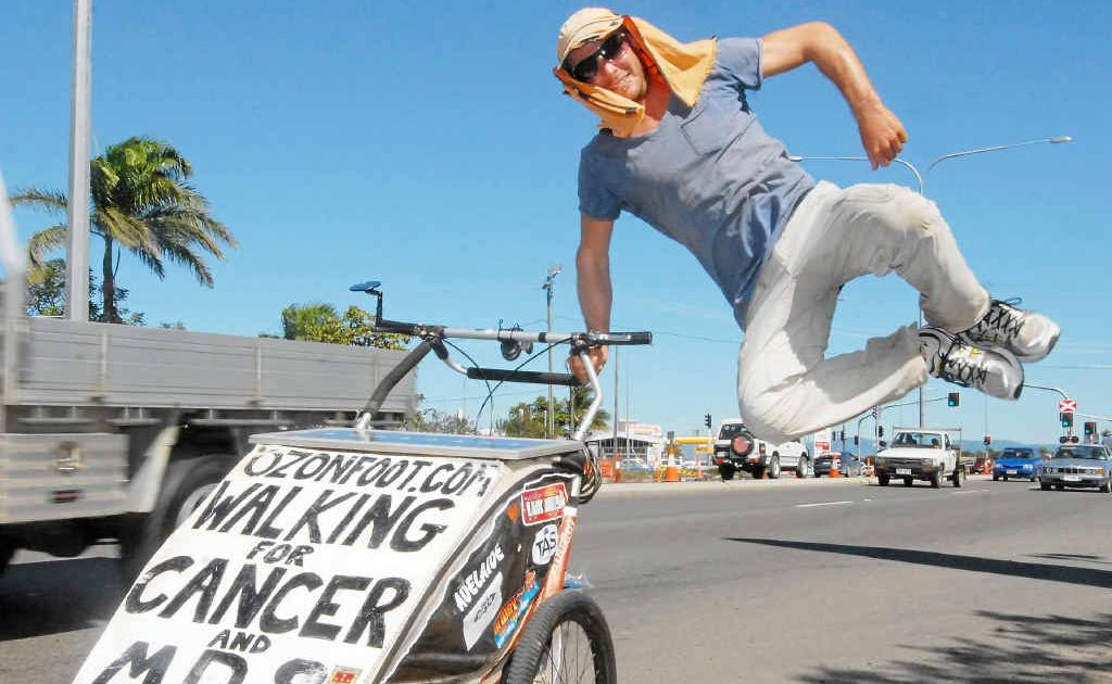 Andrew Cadigan kicks up his heels after walking into Mackay. The cancer and leukaemia fundraiser has less than 2000km to go before completing his round-Australia walk. Andrew Cadigan kicks up his heels after walking into Mackay. The cancer and leukaemia fundraiser has less than 2000km to go before completing his round-Australia walk.
