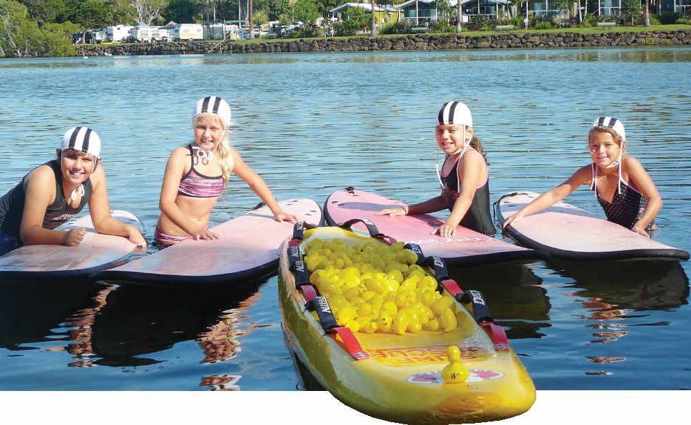 WADING IN: Brunswick Nippers Jack and Felicity Traynor, Ella Budd and Leilani Carter train their ducks for the Mullum2Bruns Paddle duck race. WADING IN: Brunswick Nippers Jack and Felicity Traynor, Ella Budd and Leilani Carter train their ducks for the Mullum2Bruns Paddle duck race.