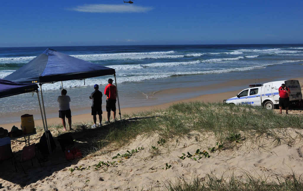 Police and surf lifesavers search for a Brisbane man on Sunday. Police and surf lifesavers search for a Brisbane man on Sunday.