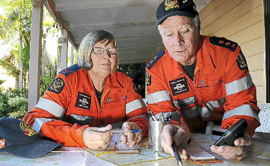 SES volunteers Jannette and Charles Elson prepare for a missing persons search exercise using maps and GPS technology. SES volunteers Jannette and Charles Elson prepare for a missing persons search exercise using maps and GPS technology.