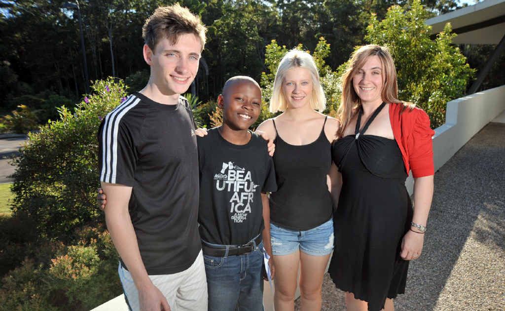 Watoto Choir member, Peter Sebatta, met up with his sponsor family during the choir's visit to the Calvary Christian Church at Tanawha. Peter is pictured with Cathy Briggs, right, and her children Laura and Jake Briggs. Watoto Choir member, Peter Sebatta, met up with his sponsor family during the choir's visit to the Calvary Christian Church at Tanawha. Peter is pictured with Cathy Briggs, right, and her children Laura and Jake Briggs.