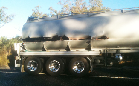 HOLEY: The hole torn in the fuel tanker following the accident on the Dawson Highway on Monday afternoon. HOLEY: The hole torn in the fuel tanker following the accident on the Dawson Highway on Monday afternoon.