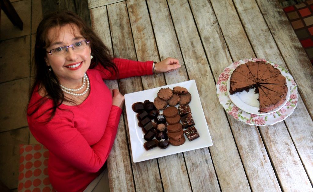 Grail Harlequin with some of her cocoa products at Flutterbies Cottage cafe. Grail Harlequin with some of her cocoa products at Flutterbies Cottage cafe.
