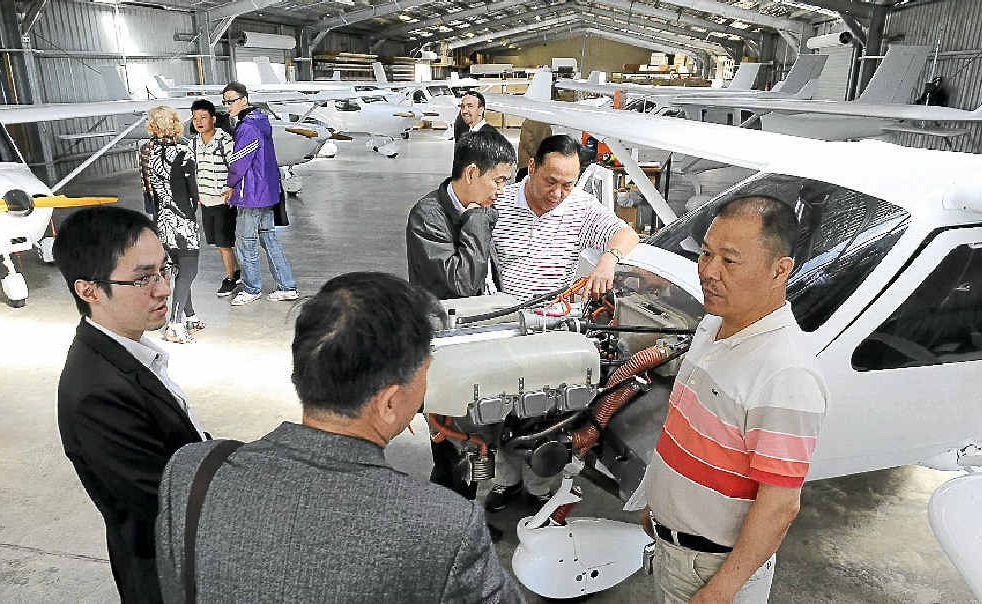 Nanning delegates Jian Jun Chen and Ning Teng study the engine of a Jabiru during their visit. Nanning delegates Jian Jun Chen and Ning Teng study the engine of a Jabiru during their visit.