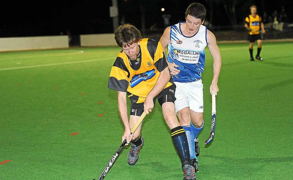 Rovers’ Dean Wightman protects the ball against an attack from Cities’ Josh Stacey in last year’s Bundaberg Division 1 men’s grand final. Rovers’ Dean Wightman protects the ball against an attack from Cities’ Josh Stacey in last year’s Bundaberg Division 1 men’s grand final.