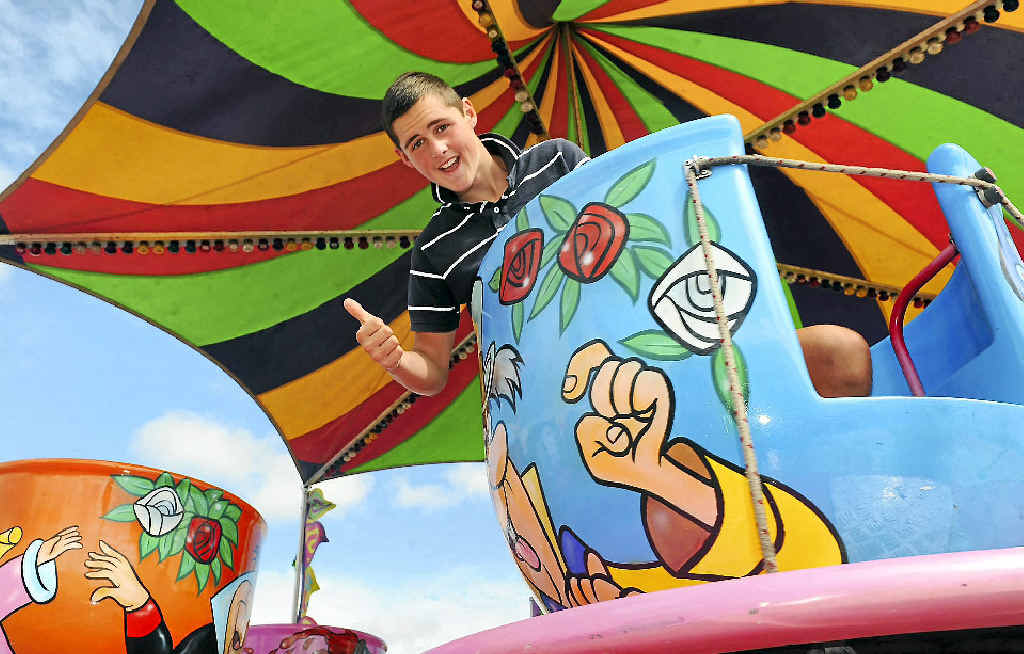 Marcus Waller warms up the teacups ahead of gates opening at the annual Bundaberg Show today. Marcus Waller warms up the teacups ahead of gates opening at the annual Bundaberg Show today.