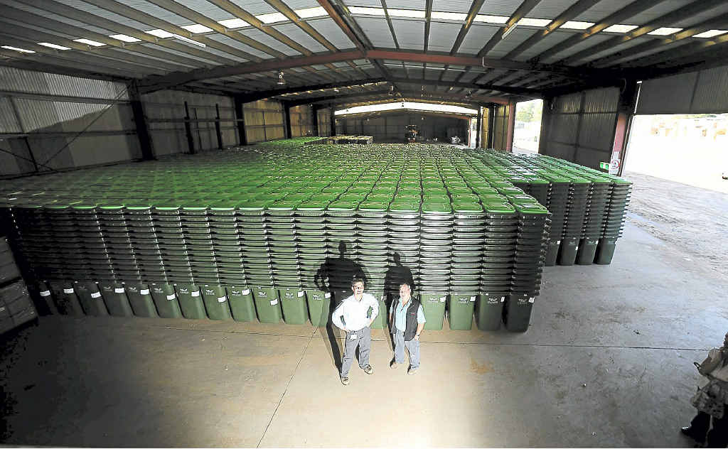 Clarence Valley Council environmental officer Richard Roper and J.R. Richards and Sons regional manager Phil Baynham with some of the 40,000 new waste bins. Clarence Valley Council environmental officer Richard Roper and J.R. Richards and Sons regional manager Phil Baynham with some of the 40,000 new waste bins.