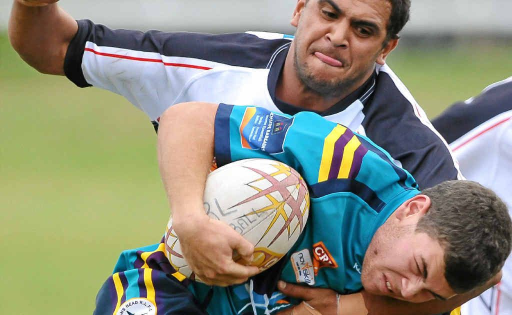 CHOP DOWN: Lower Clarence defender Grant Brown hits his Evans Head opponent with a strong tackle. Photo: Adam Hourigan CHOP DOWN: Lower Clarence defender Grant Brown hits his Evans Head opponent with a strong tackle. Photo: Adam Hourigan