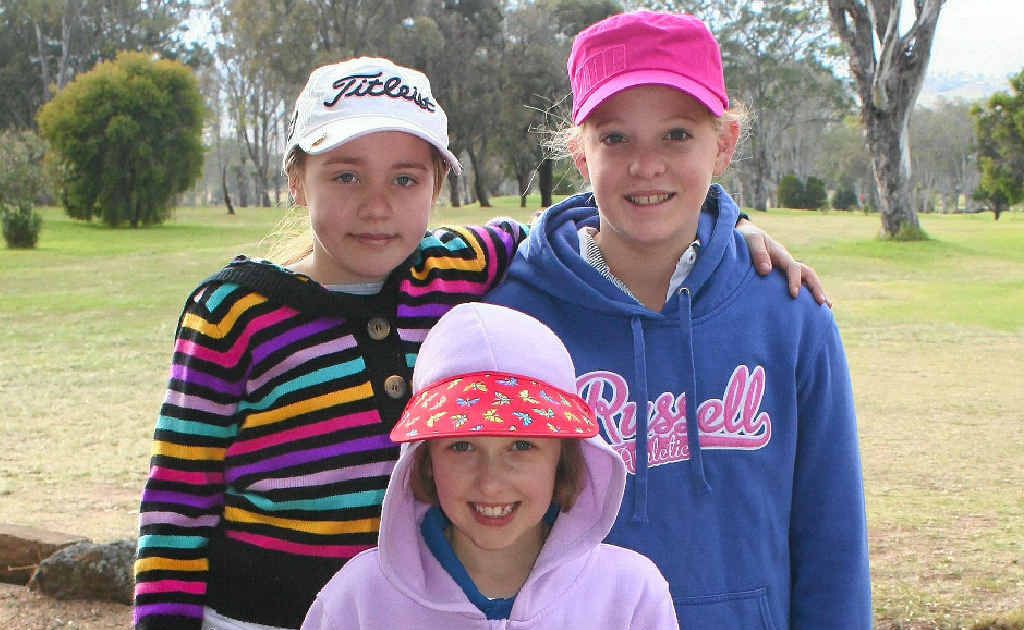 (Back, from left) Lacey Hinze, Eliza McLennan and (front) Samantha Joyce rug up for junior golf. (Back, from left) Lacey Hinze, Eliza McLennan and (front) Samantha Joyce rug up for junior golf.