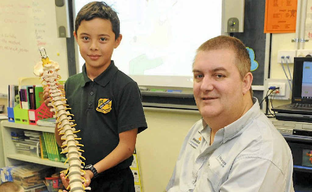 Booyal Central State School captain Joshua McDonnell and spinal injuries presenter Wayne Horkings. Booyal Central State School captain Joshua McDonnell and spinal injuries presenter Wayne Horkings.