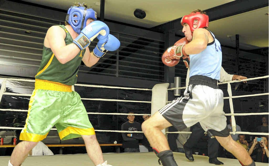 Yamba boxer Keaton Rheinberger (blue singlet) took the North Coast 71kg title against Dorrigo boxer Daniel Glanville (green) at the Yamba Shores Tavern on Saturday night. Yamba boxer Keaton Rheinberger (blue singlet) took the North Coast 71kg title against Dorrigo boxer Daniel Glanville (green) at the Yamba Shores Tavern on Saturday night.