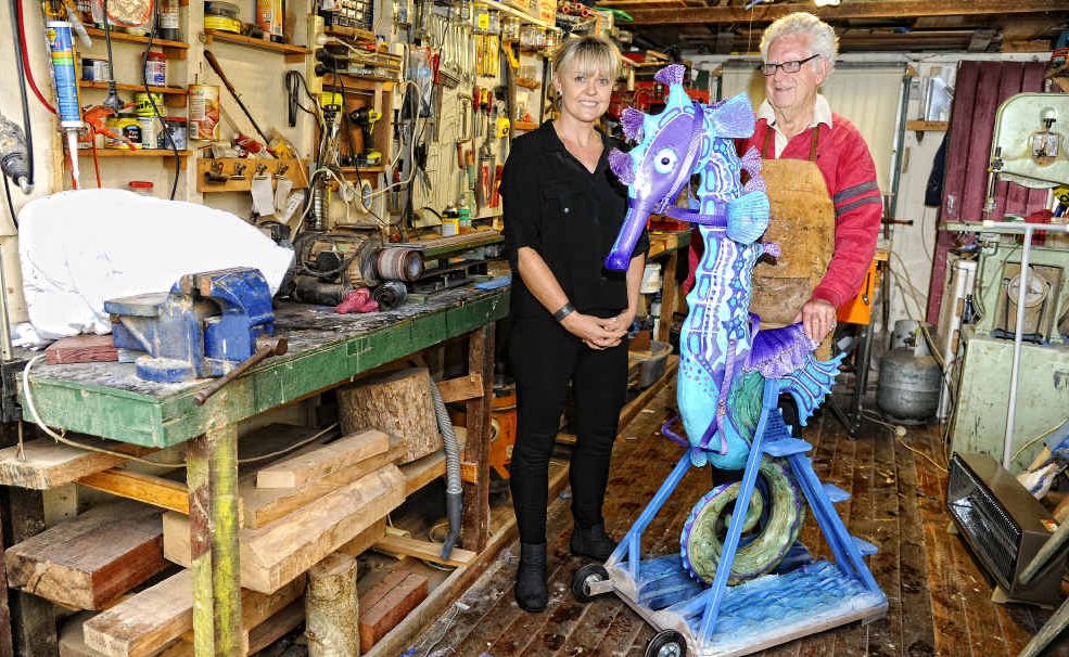 Roches Hotel manager Leanne Brien and woodworker Greg Ryan with his seahorse rocker – to be raffled in a fundraiser by Jaca Queen candidate Sharni Rouse. Roches Hotel manager Leanne Brien and woodworker Greg Ryan with his seahorse rocker – to be raffled in a fundraiser by Jaca Queen candidate Sharni Rouse.