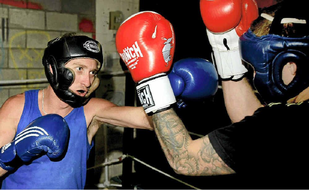 Mick McAndrew strives to place a straight left between Elliott Balk’s gloves during a spar at Balk’s South Tweed Heads gym on Wednesday. McAndrew headlines Stuart Stone’s fight card at Condong tonight. Photo: John Gass TWE030712boxing1 Mick McAndrew strives to place a straight left between Elliott Balk’s gloves during a spar at Balk’s South Tweed Heads gym on Wednesday. McAndrew headlines Stuart Stone’s fight card at Condong tonight. Photo: John Gass TWE030712boxing1