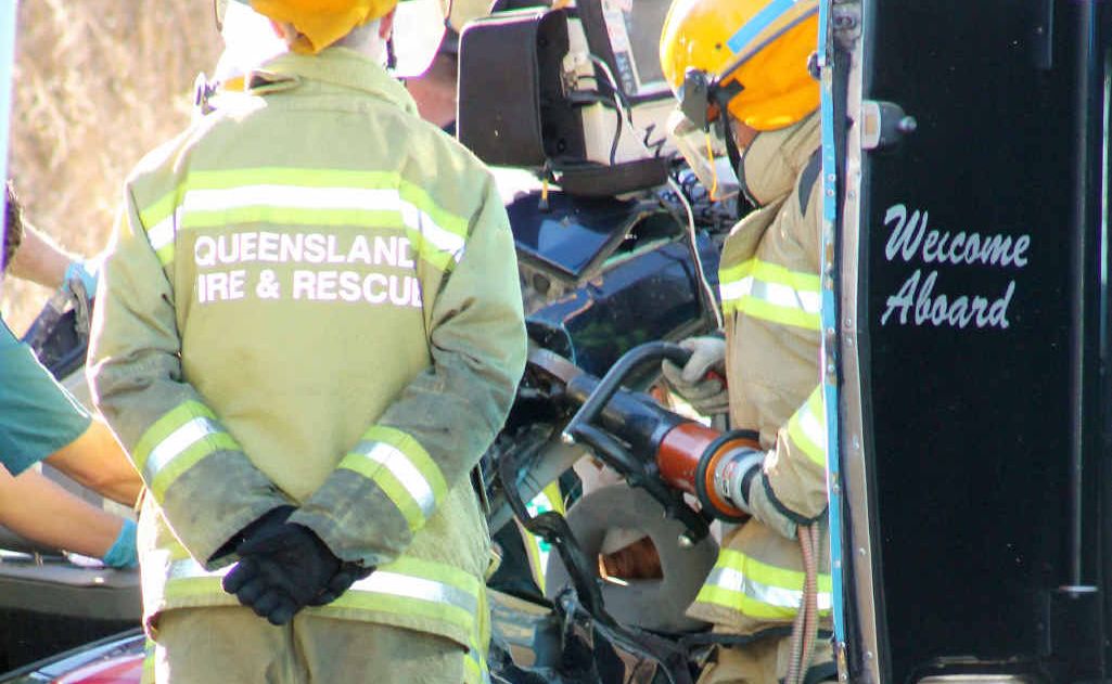 Queensland Fire and Rescue crews work to free the trapped female student driver. Queensland Fire and Rescue crews work to free the trapped female student driver.