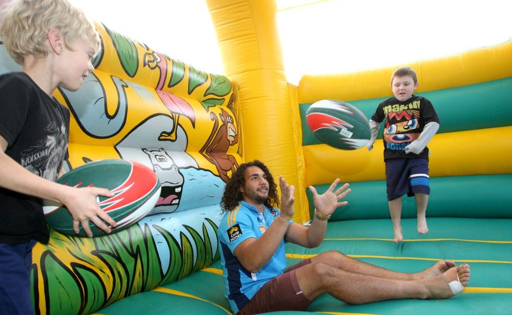 Titans player Ryan James with Jamie Fox- Morrison (right) and Wyatt Snart. Titans player Ryan James with Jamie Fox- Morrison (right) and Wyatt Snart.