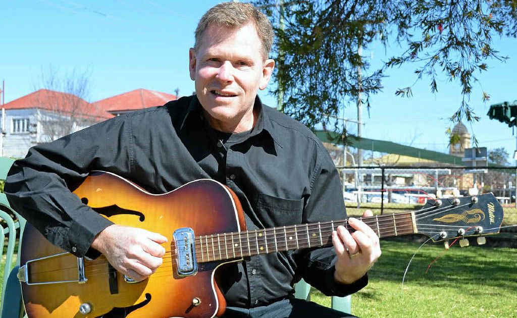 Andrew Carines holds his late uncle’s guitar at the Vietnam Veterans Day service at the weekend. Andrew Carines holds his late uncle’s guitar at the Vietnam Veterans Day service at the weekend.