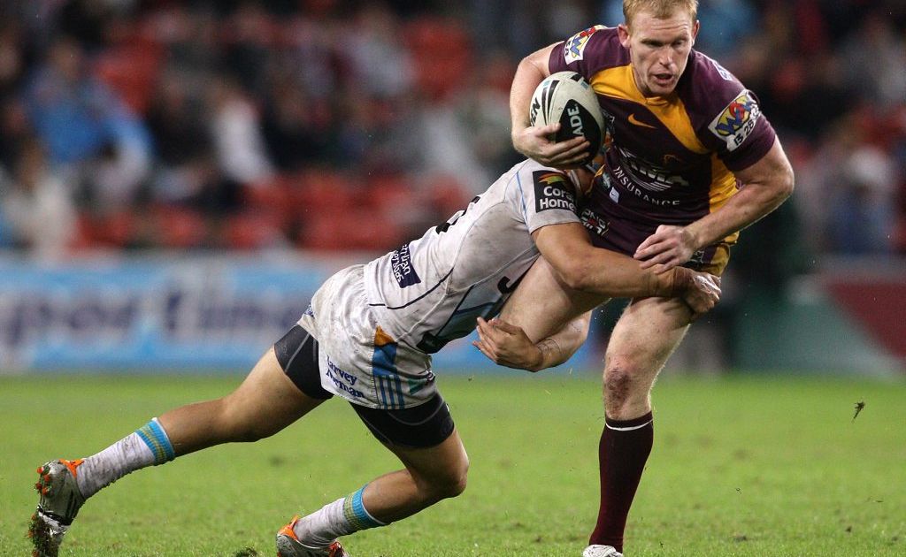 Peter Wallace of the Broncos is tackled during the round 19 NRL match between the Brisbane Broncos and the Gold Coast Titans at Suncorp Stadium on July 15, 2011 in Brisbane, Australia. Peter Wallace of the Broncos is tackled during the round 19 NRL match between the Brisbane Broncos and the Gold Coast Titans at Suncorp Stadium on July 15, 2011 in Brisbane, Australia.